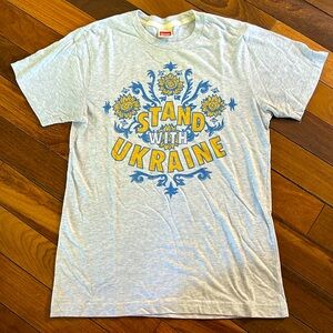 HOMAGE Light Gray Tee with Blue and Yellow "Stand With Ukraine" Graphic